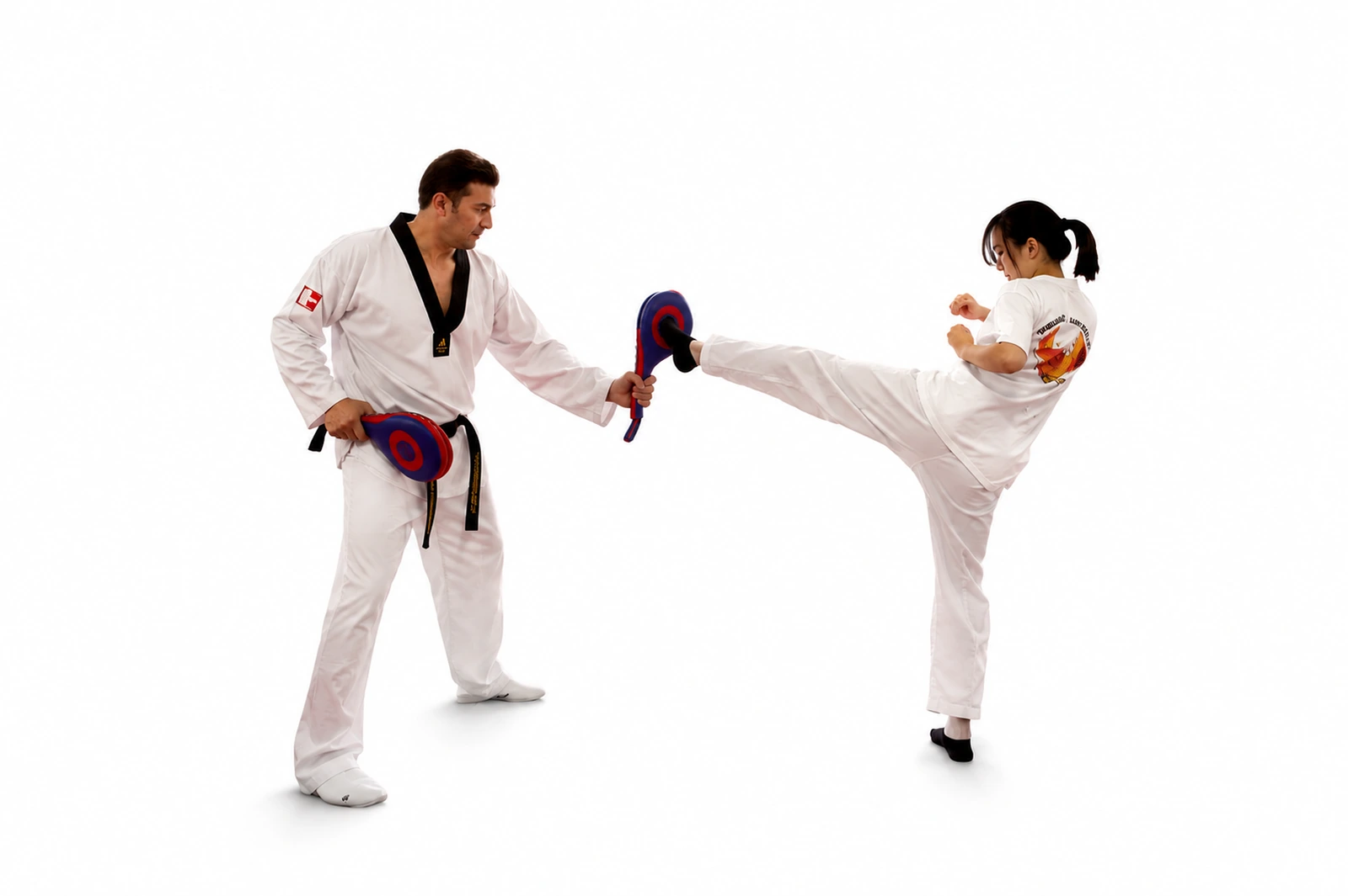 Master David holding a kicking target during Taekwondo training